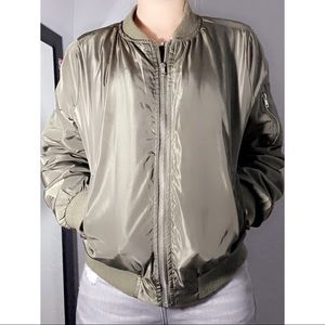 Navy green windbreaker jacket. In size large.